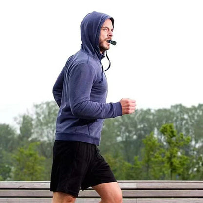 HealthyRealLife man jogging outdoors using portable breathing trainer for lung health mouthpiece on lanyard