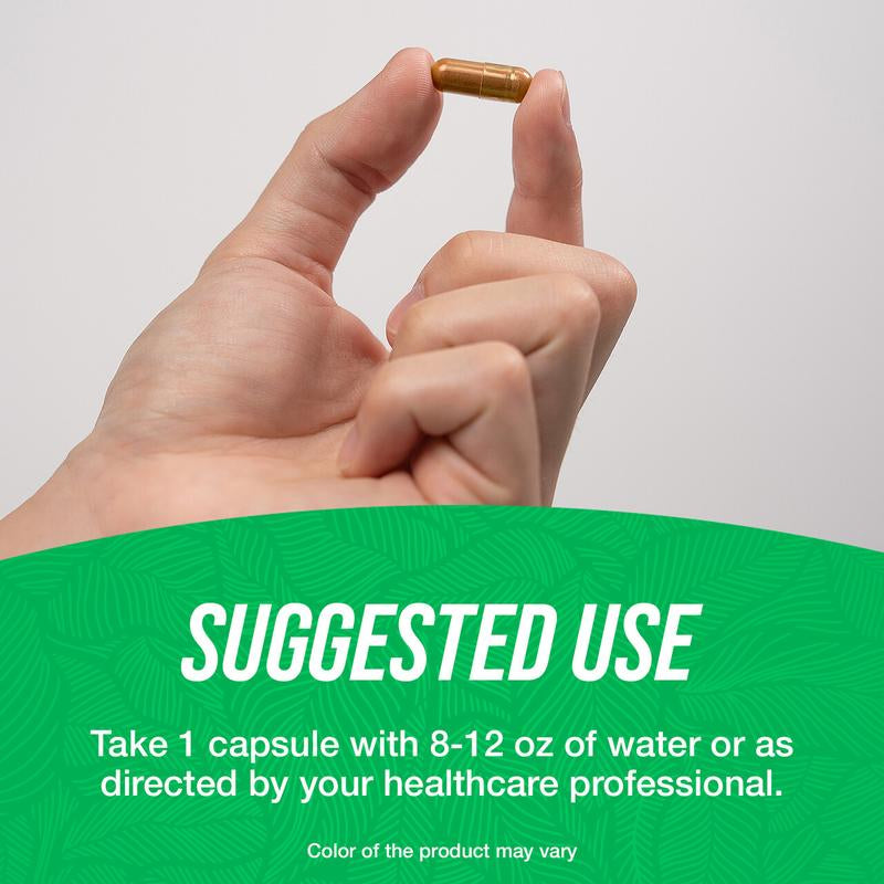 Hand holding a single golden capsule above suggested use label for saffron extract capsules