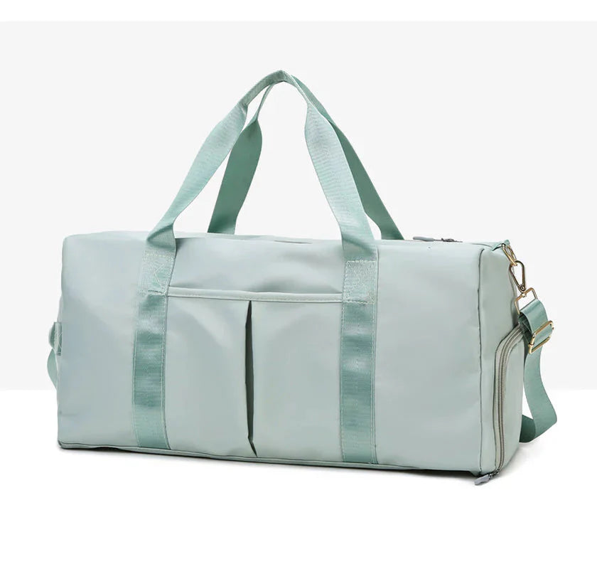 HealthyRealLife waterproof fitness duffel bag in mint green with dual handles shoulder strap and front pockets