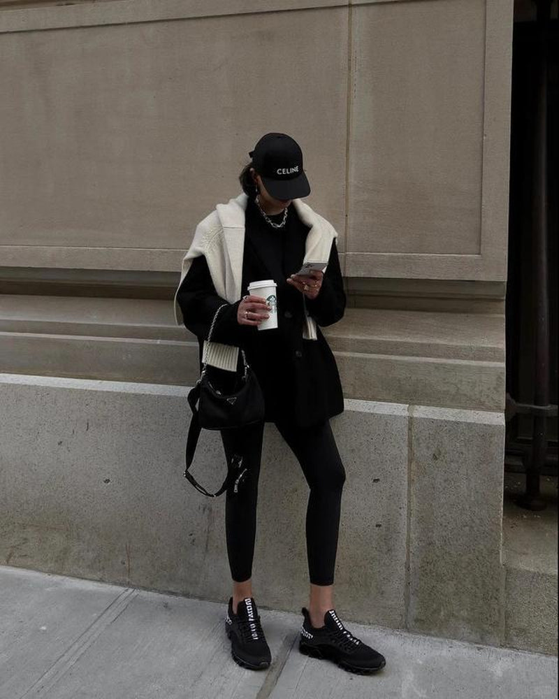 HealthyRealLife women's lace-up sneakers black knit low profile worn with casual streetwear outfit and coffee