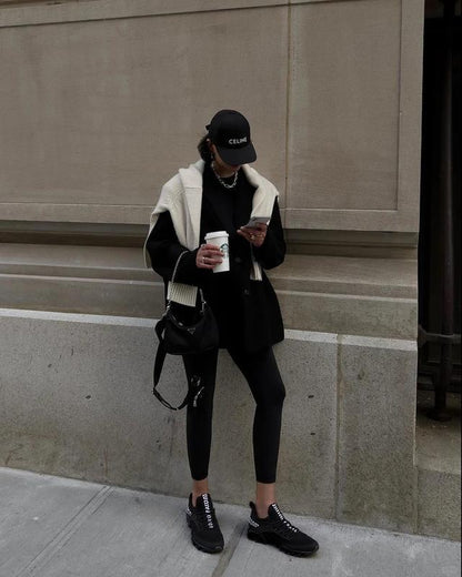HealthyRealLife women's lace-up sneakers black knit low profile worn with casual streetwear outfit and coffee