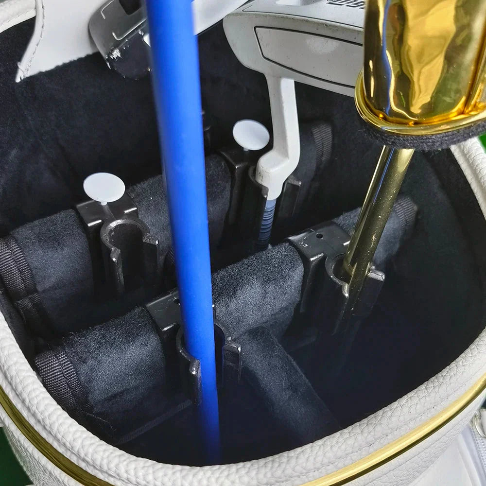 Golf club bag clips holding various clubs upright in a white velvet lined golf bag top view