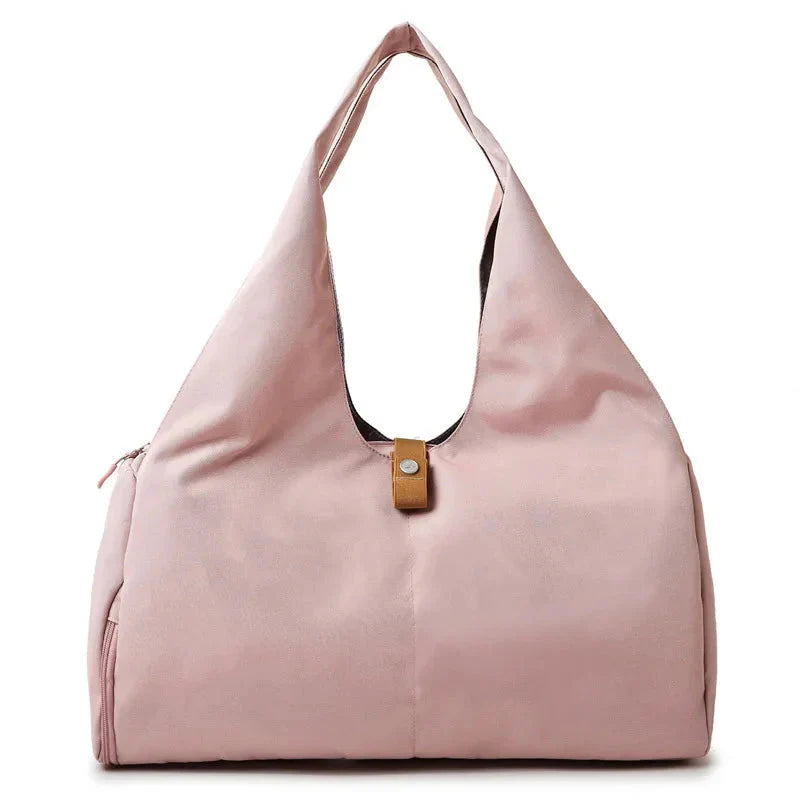 HealthyRealLife women's waterproof gym bag in blush pink with roomy tote shape and side zip pocket